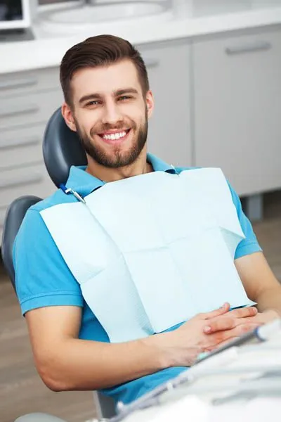 patient smiling in the dental chair at Clayton Dental Group in Concord, CA